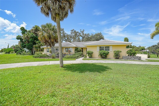 ranch-style house with a front lawn