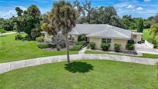 ranch-style house with a front lawn