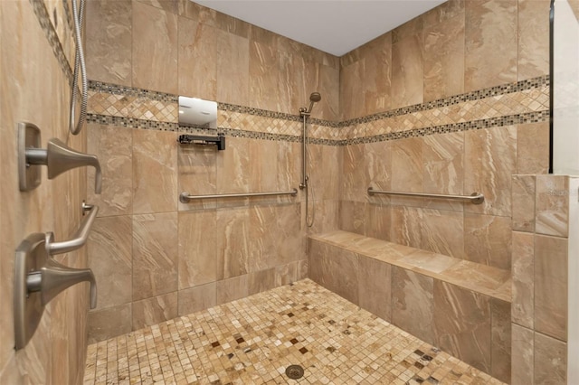 bathroom featuring tiled shower