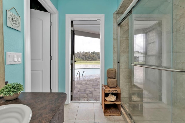 bathroom with vanity, tile patterned floors, and walk in shower