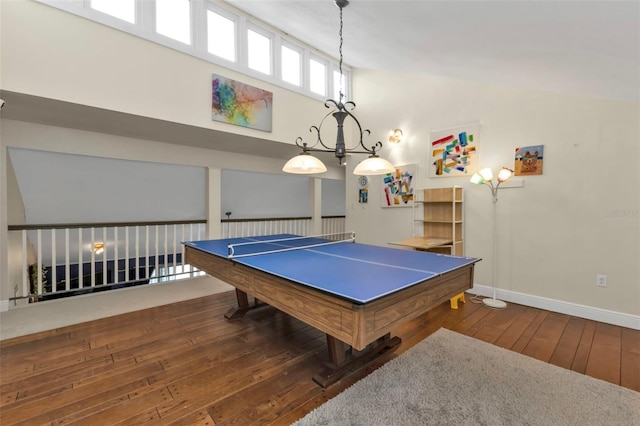 playroom featuring dark hardwood / wood-style flooring and high vaulted ceiling