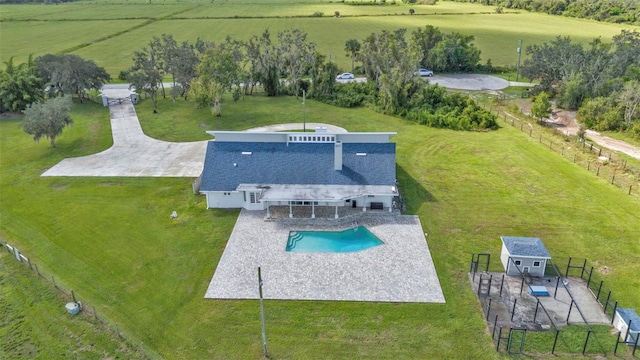 birds eye view of property featuring a rural view