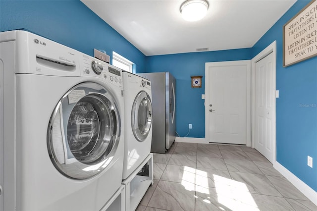 laundry room with independent washer and dryer