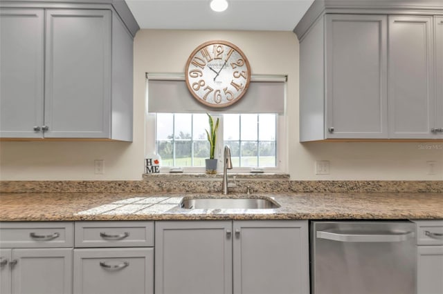 kitchen with gray cabinets, sink, and stainless steel dishwasher