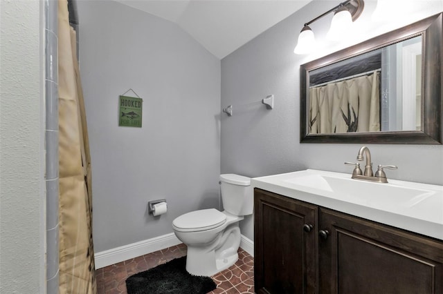 bathroom with a shower with curtain, vanity, toilet, and lofted ceiling