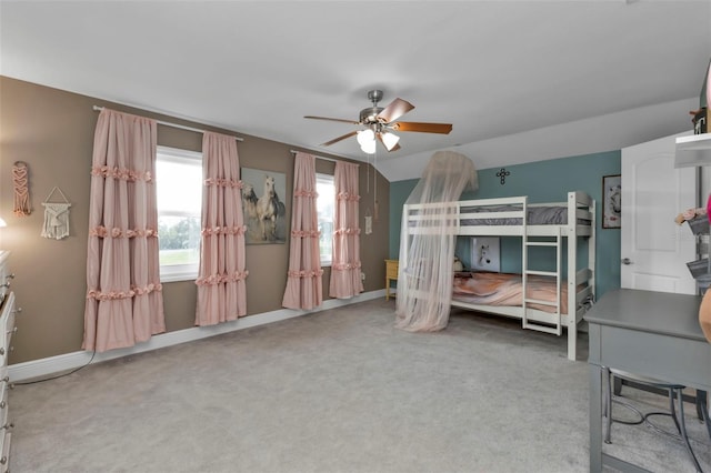 bedroom featuring ceiling fan and carpet