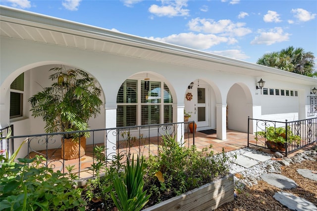 view of front of home featuring a garage and covered porch