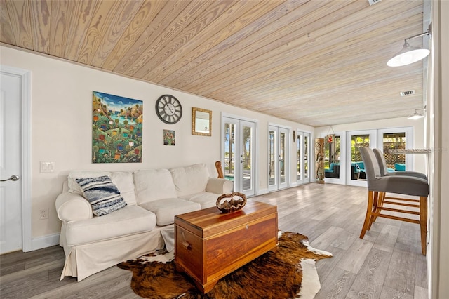 living room with wooden ceiling, french doors, and light hardwood / wood-style flooring