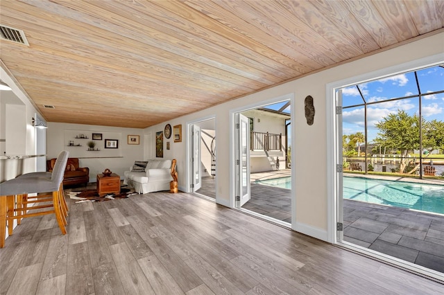 interior space with wooden ceiling and a swimming pool