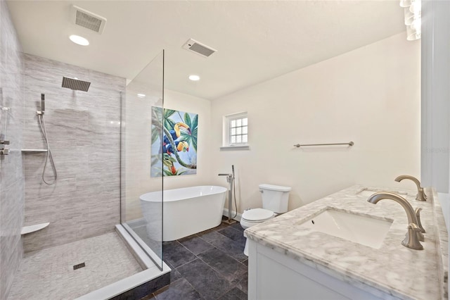 full bathroom featuring vanity, toilet, and shower with separate bathtub