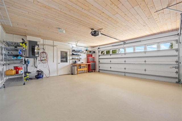 garage featuring a garage door opener, wood ceiling, and electric panel