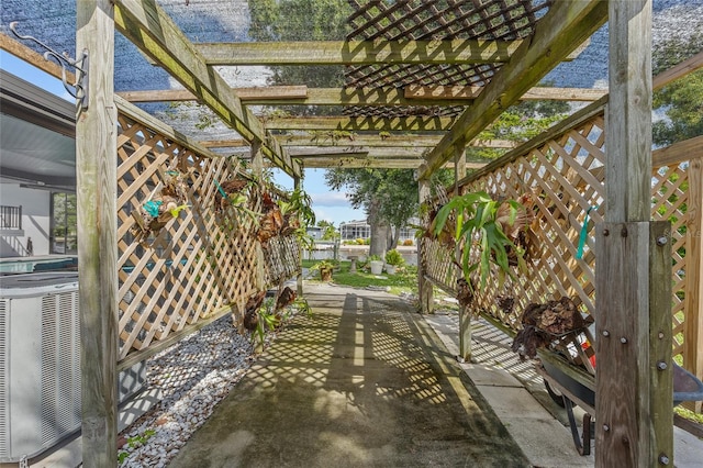 view of patio / terrace featuring a pergola and cooling unit