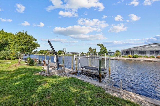 view of dock featuring a water view and a yard