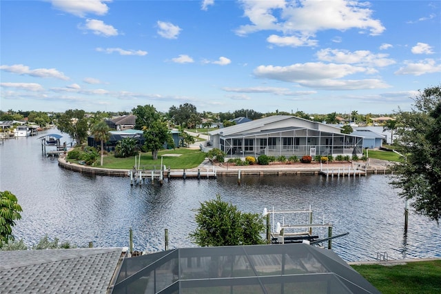 dock area with a lanai and a water view