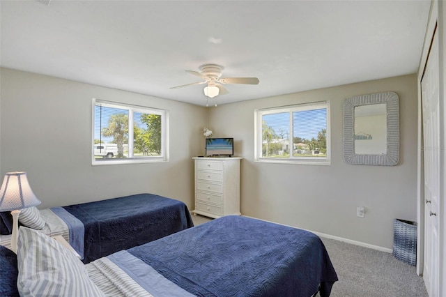 carpeted bedroom with ceiling fan