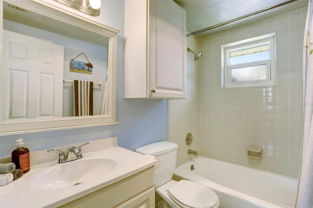 full bathroom with vanity, shower / bath combo with shower curtain, and toilet