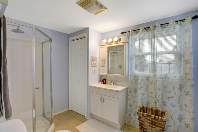 bathroom with walk in shower, tile patterned flooring, vanity, and toilet