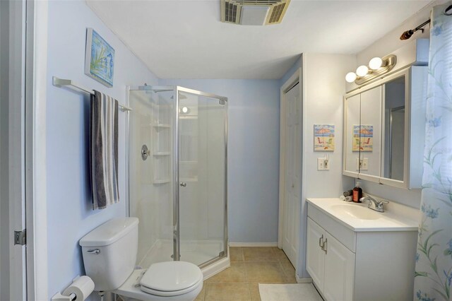 bathroom featuring walk in shower, tile patterned flooring, vanity, and toilet