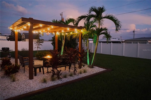 view of yard at dusk