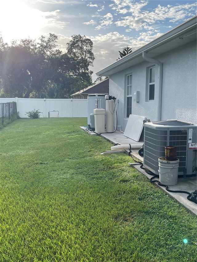 view of yard with central AC unit