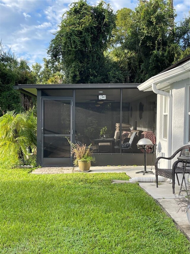 view of yard featuring a sunroom