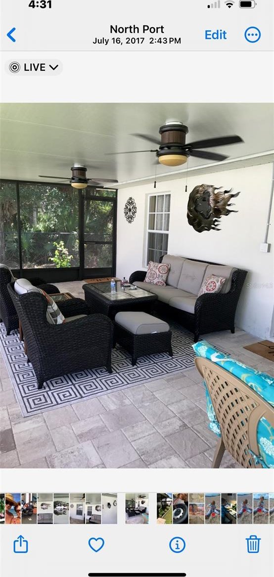 interior space featuring an outdoor hangout area and ceiling fan