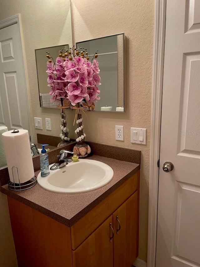 2106 Switzerland Rd, North Port, FL 34288 - bathroom featuring vanity and a textured wall