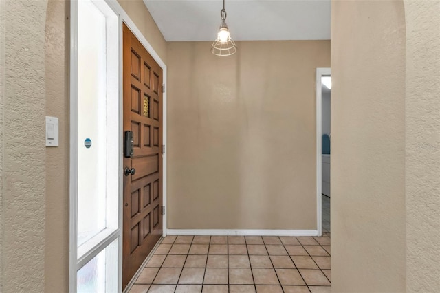 entryway with light tile patterned flooring