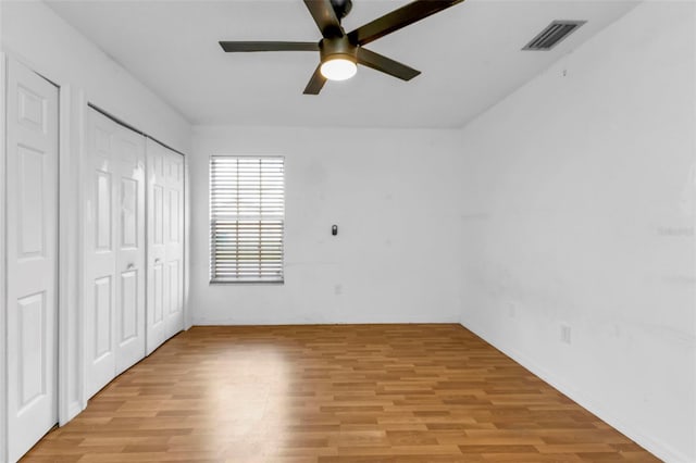 unfurnished bedroom with light hardwood / wood-style floors and ceiling fan