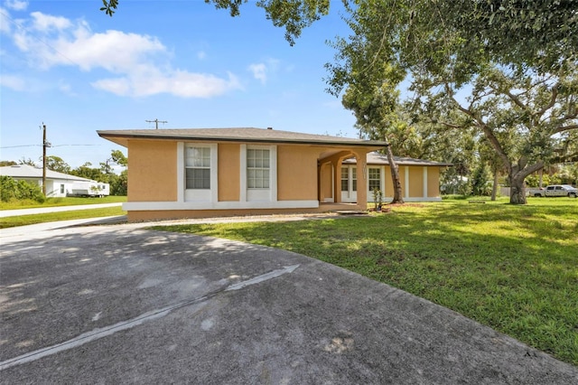 ranch-style house with a front yard