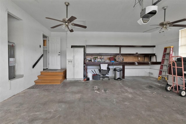 garage with a garage door opener, water heater, ceiling fan, and white refrigerator with ice dispenser