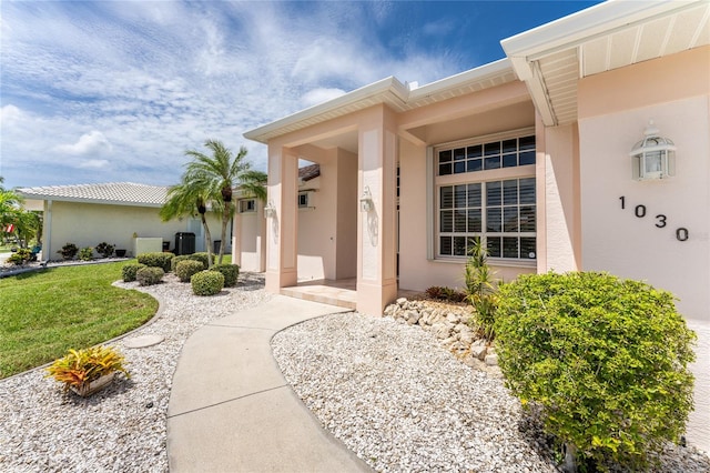 entrance to property with a yard