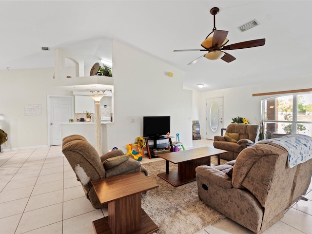 tiled living room featuring vaulted ceiling and ceiling fan