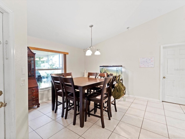 tiled dining area with an inviting chandelier