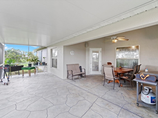 sunroom / solarium with ceiling fan