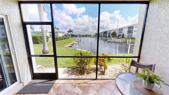 sunroom with a water view