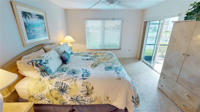 bedroom with light carpet, ceiling fan, and access to outside