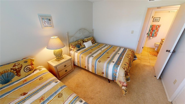 bedroom with light colored carpet