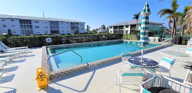 view of swimming pool featuring a patio