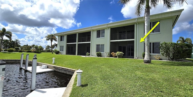 dock area featuring a lawn