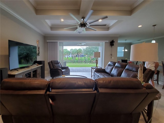 living room featuring ceiling fan, ornamental molding, and coffered ceiling