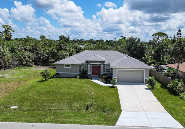 ranch-style home featuring a garage and a front lawn