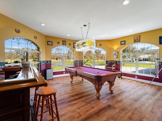 playroom featuring a wealth of natural light, pool table, and wood-type flooring