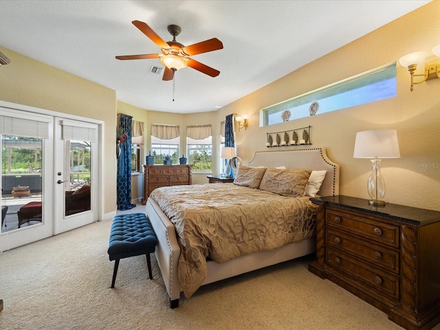 bedroom with light carpet, access to outside, and ceiling fan