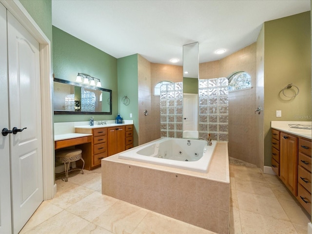 bathroom featuring vanity and shower with separate bathtub