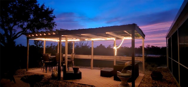 patio terrace at dusk with a pergola