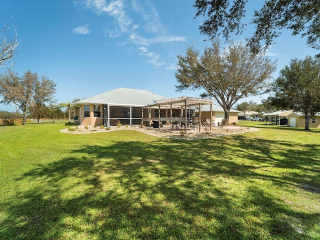 view of yard with a sunroom and a pergola