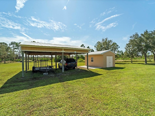 view of parking with a yard and a carport