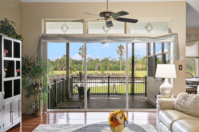 sunroom / solarium with ceiling fan