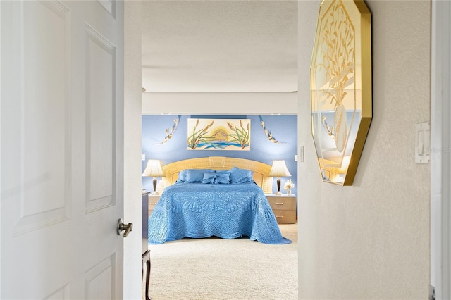 carpeted bedroom with a textured ceiling